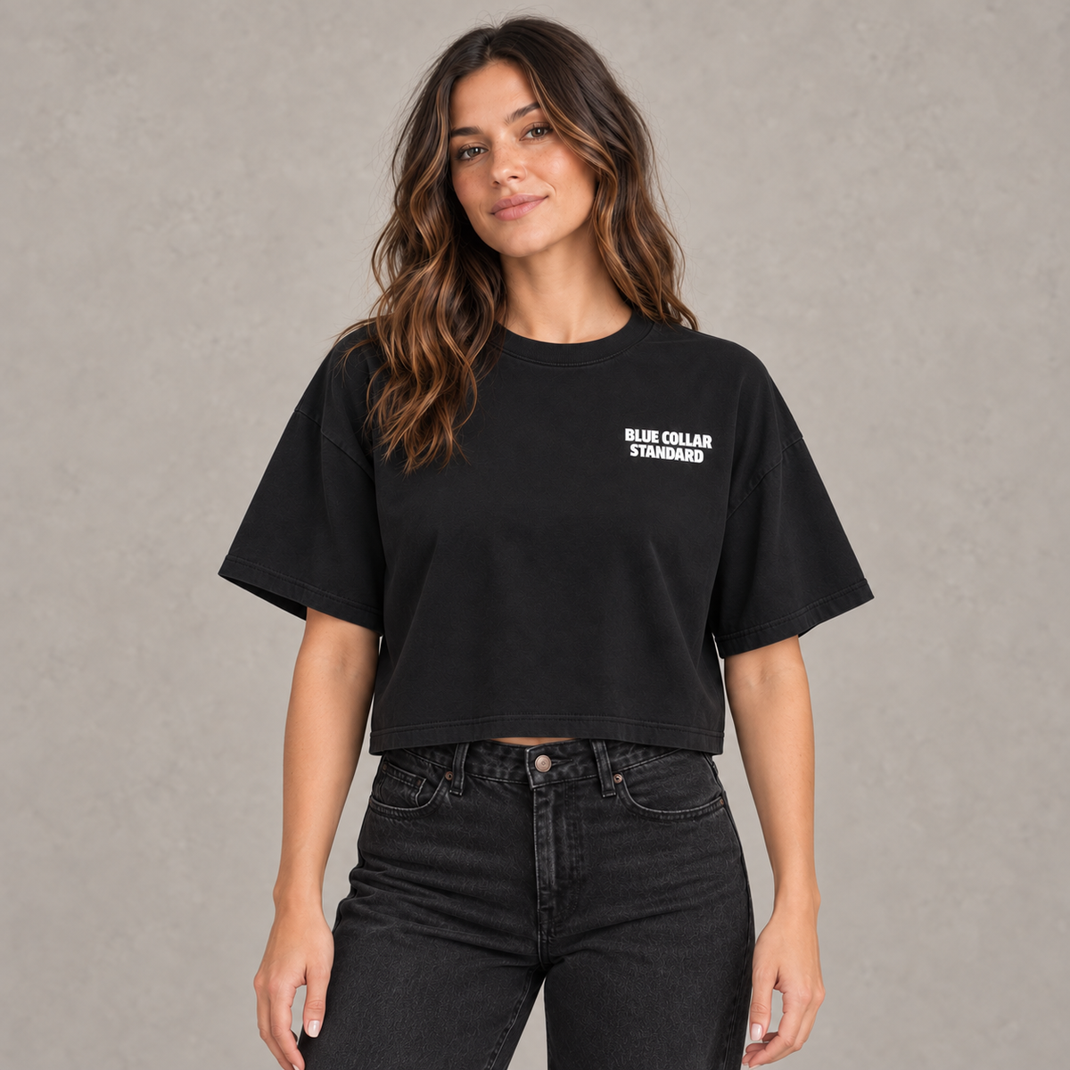 Woman wearing the black Standard Heavyweight Crop Tee, front view with Blue Collar Standard chest logo