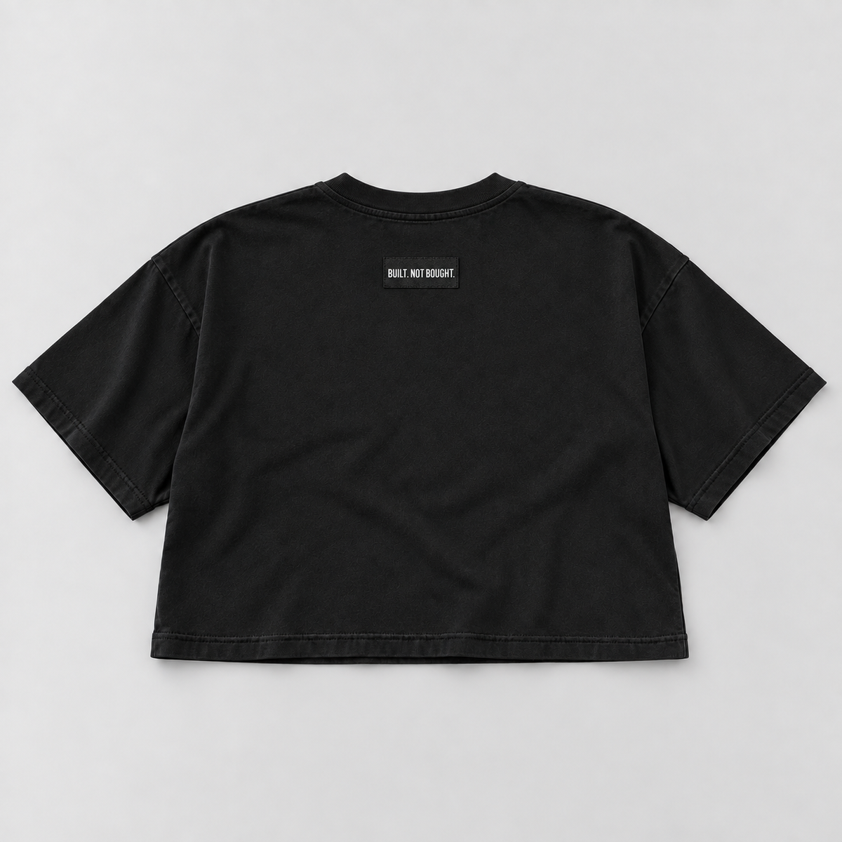 Black Standard Heavyweight Crop Tee, back view with Built. Not Bought. woven shoulder label