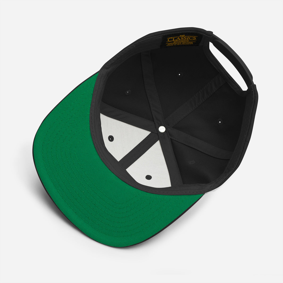 Close-up of BCS snapback hat details: embroidered eyelets and green undervisor